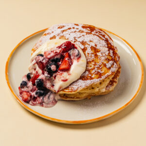 pancakes with citrus cream and berry sauce
